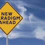 Conceptual road sign on change and paradigms (against a dramatic sky background)