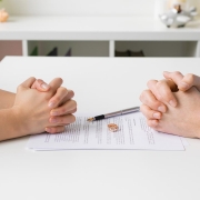 Couple going through divorce signing papers